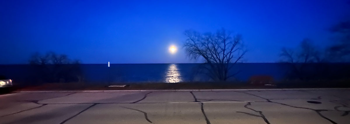 Effulgent moon over Lake Michigan